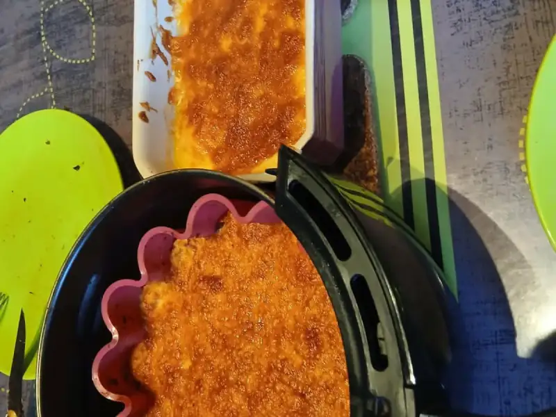 Golden baked carrot mash in a silicone mold from the air fryer and in a baking dish