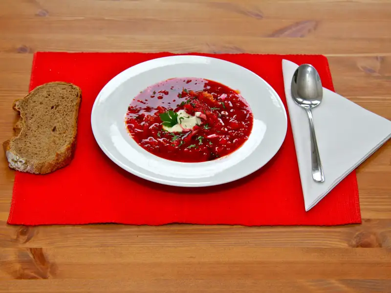 Beef and beet soup with cabbage and dill, with sour cream