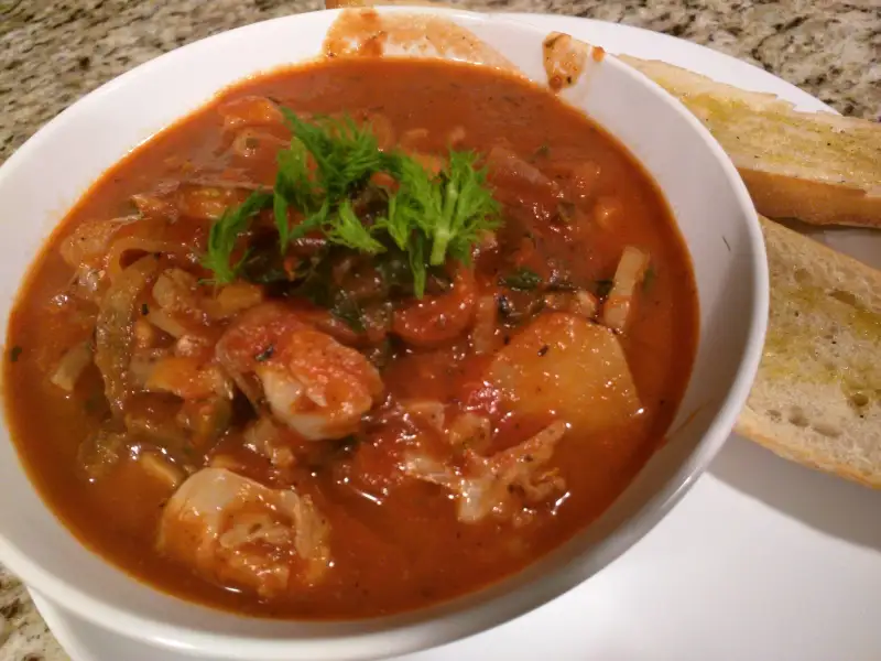 Fish soup with lemon, celery, and bread