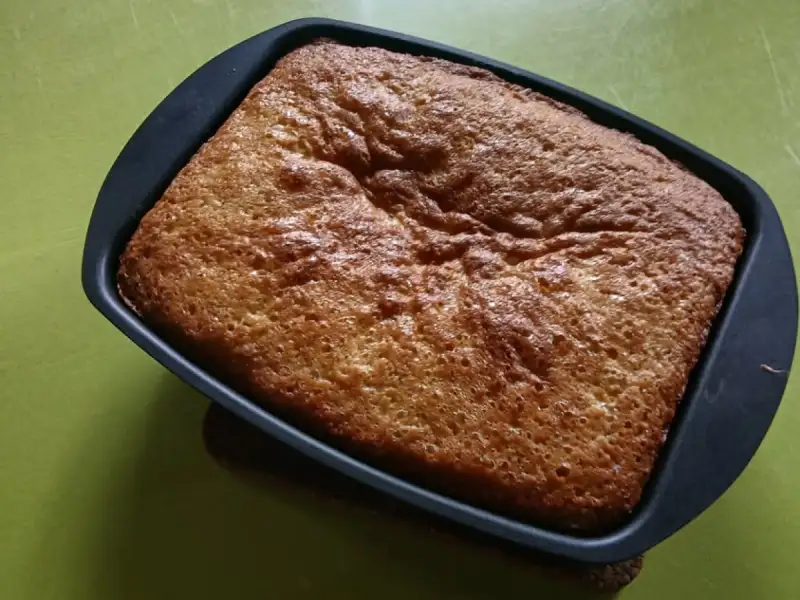 Golden, well-risen fruit pound cake in a rectangular pan