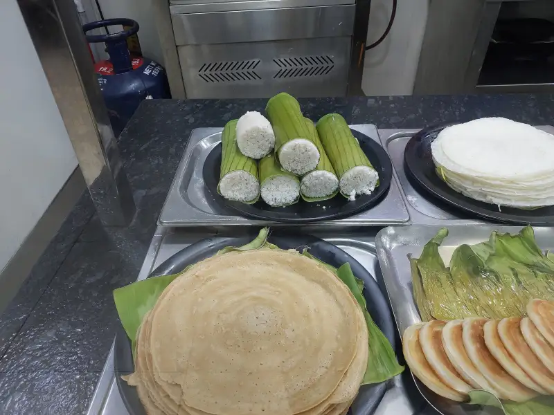 Puttu: A steamed rice flour and coconut dessert.