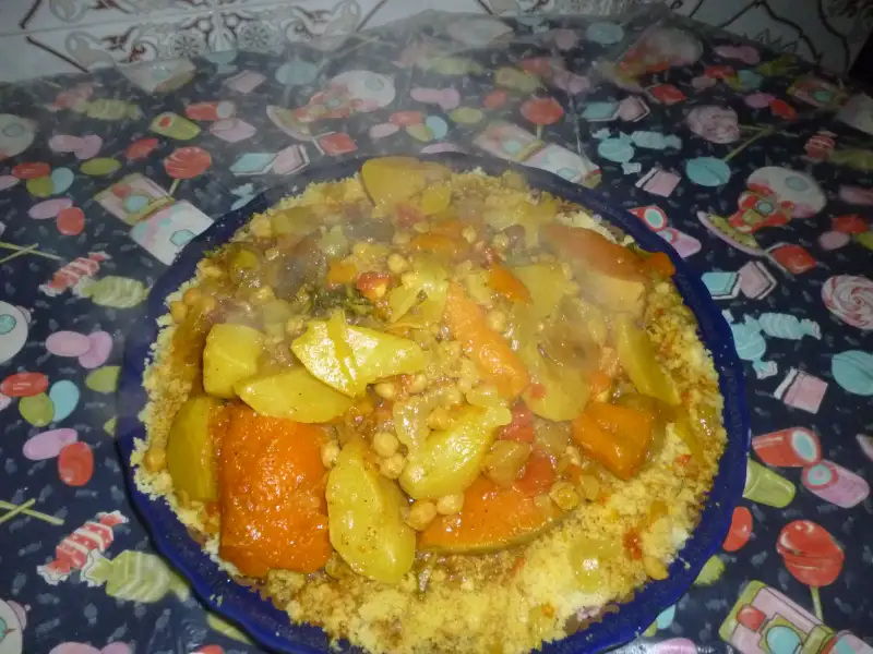Royal couscous with meat, vegetables, and harissa